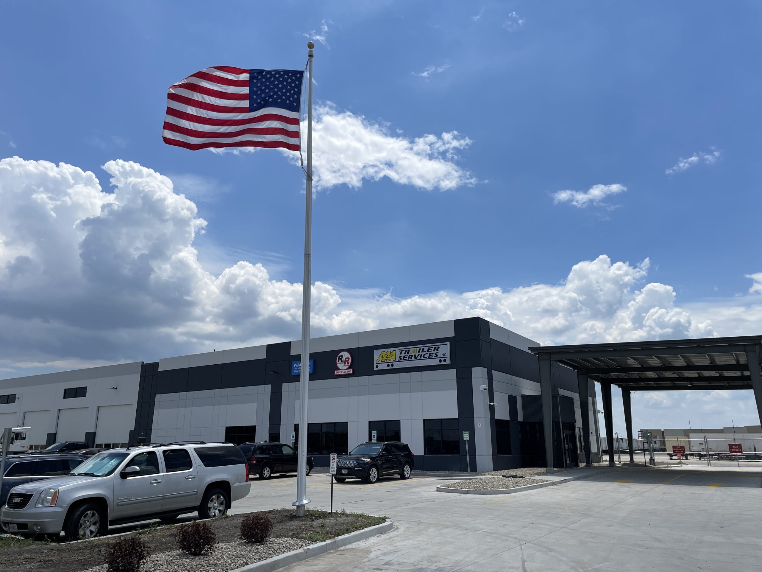 River-Roads American Flag River-Roads front entrance with american flag flying