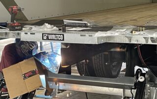Waltco Liftgate being welded onto a Wabash truck body 2